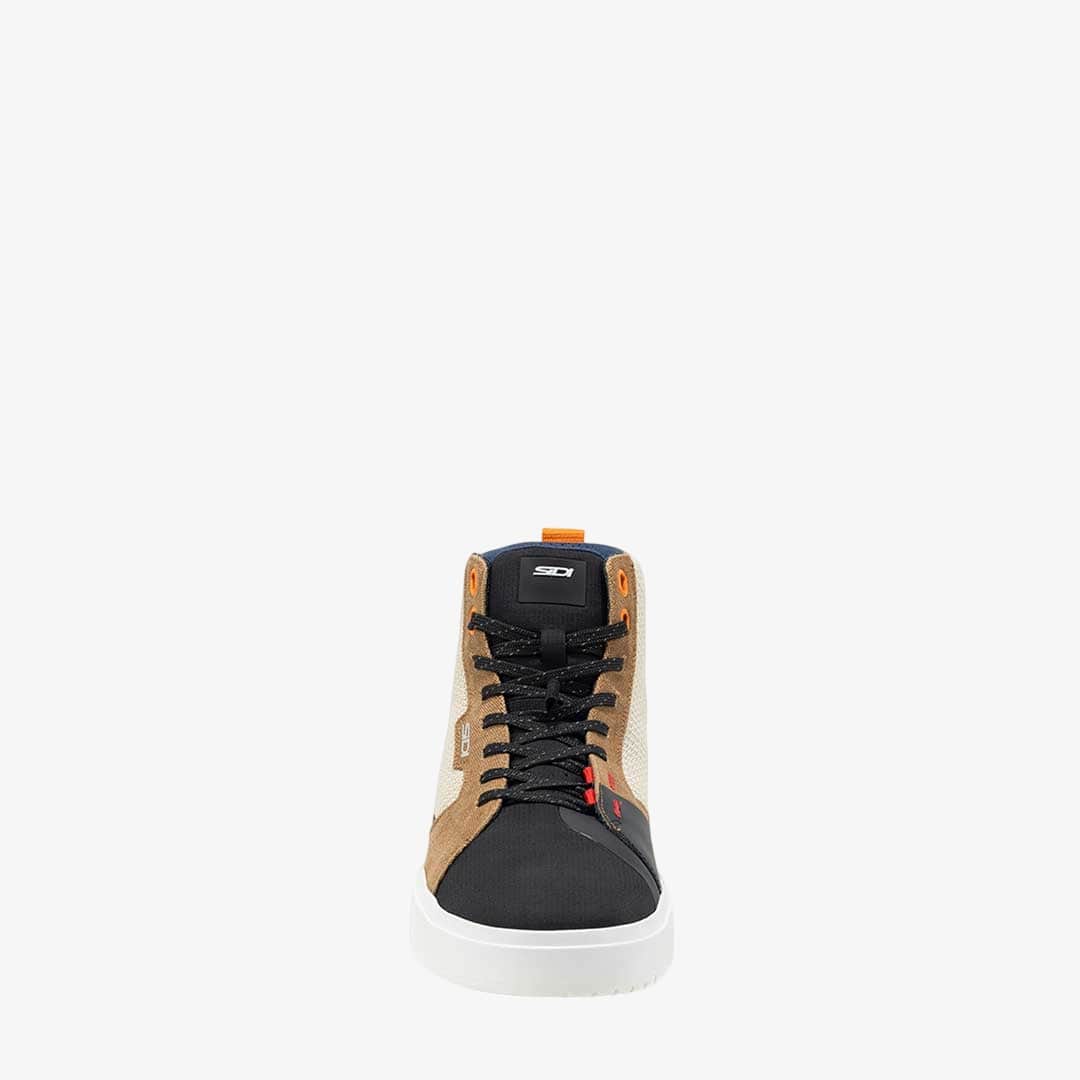 front of black and brown lace up motorbike trainers