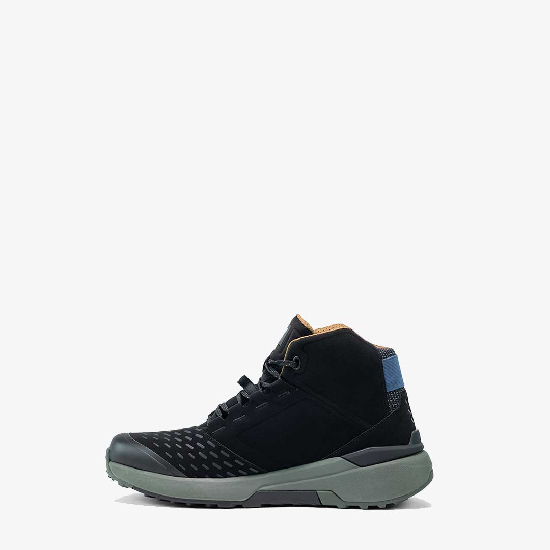 side of black waterproof motorcycle trainers with green sole