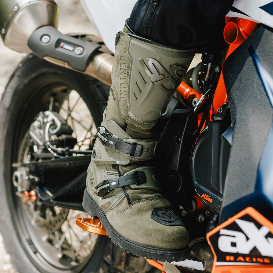 biker wearing military green sidi motorcycle boots on bike