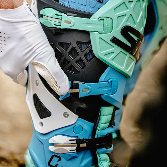 closeup of blue and green crossair x sidi boots hinges