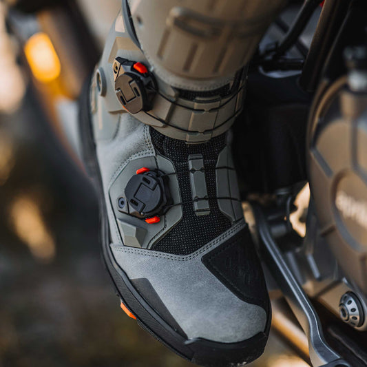 biker wearing the sidi taurus gtx 2026 boots in grey and black for off road biking