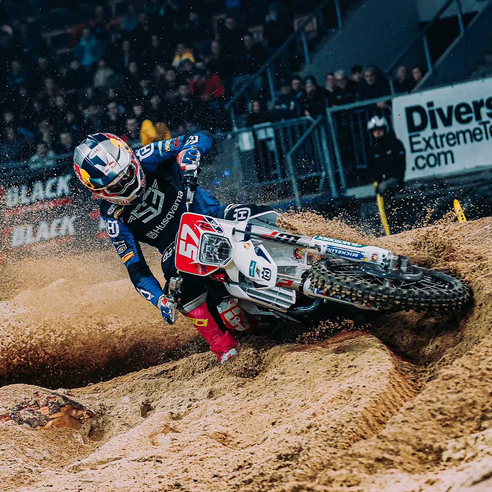 Billy Bolt rider on motorbike on dirt track wearing motorbike gear