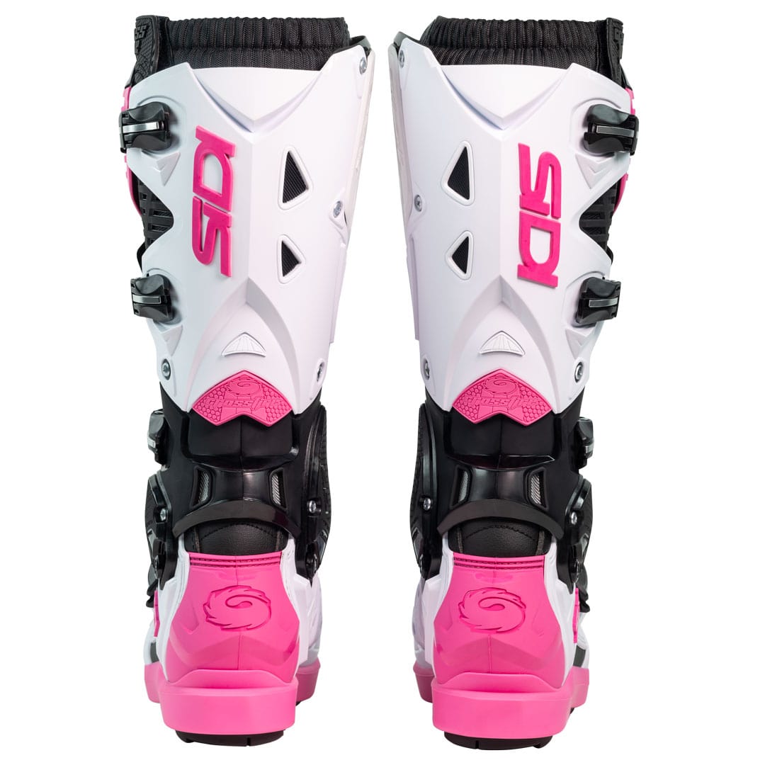 back of a pair of black white and pink motorbike boots