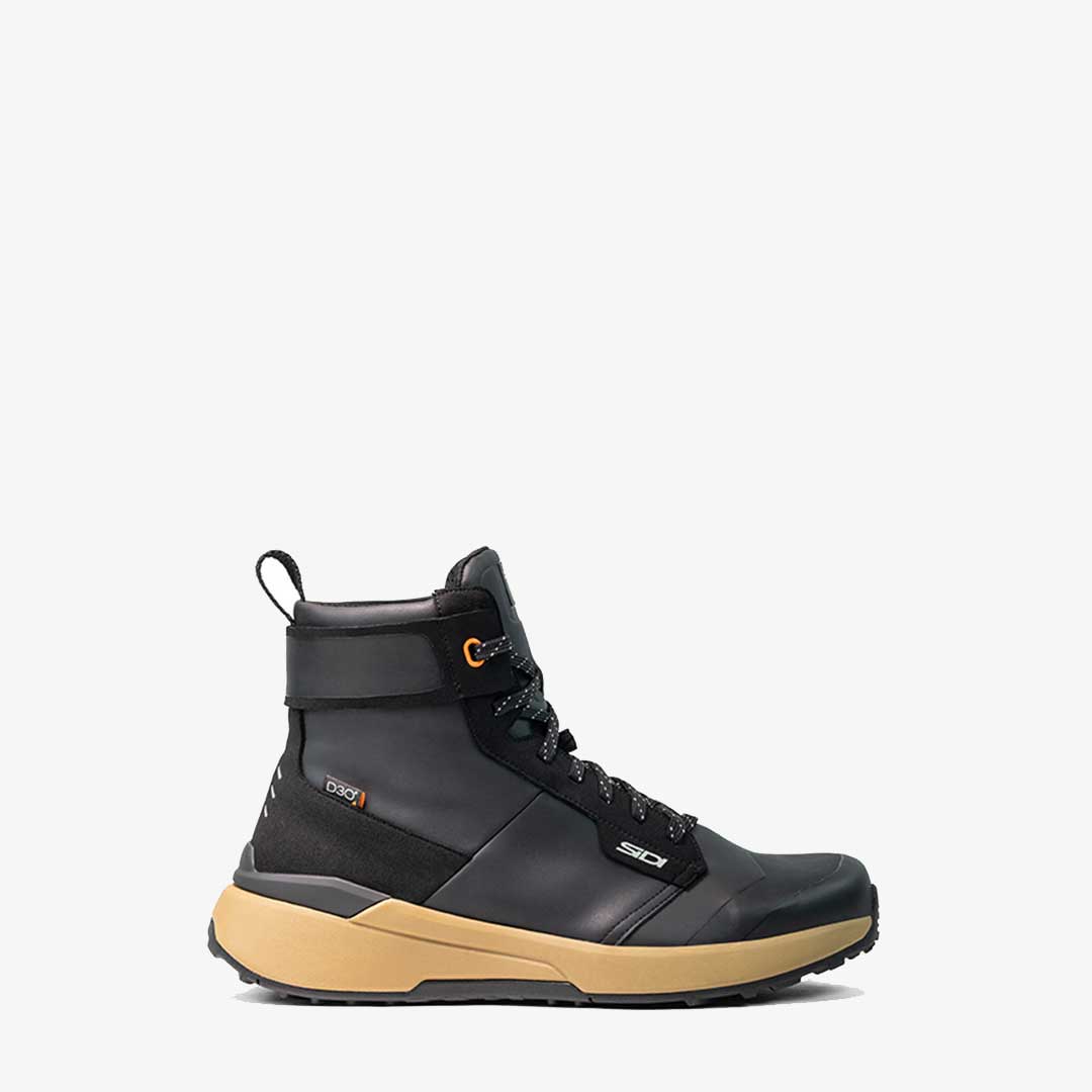 side of black and brown motorbike boots