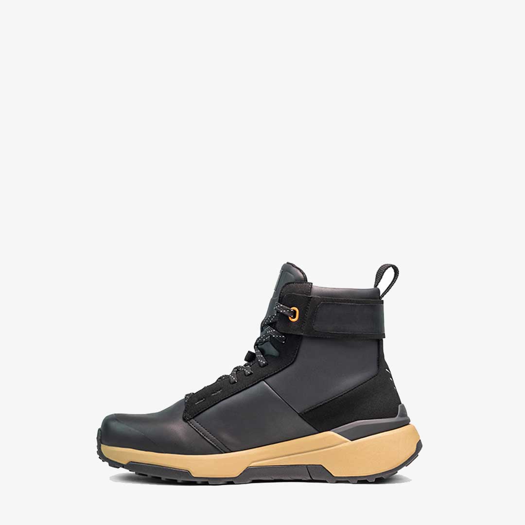 side of black and brown sidi motorcycle shoes
