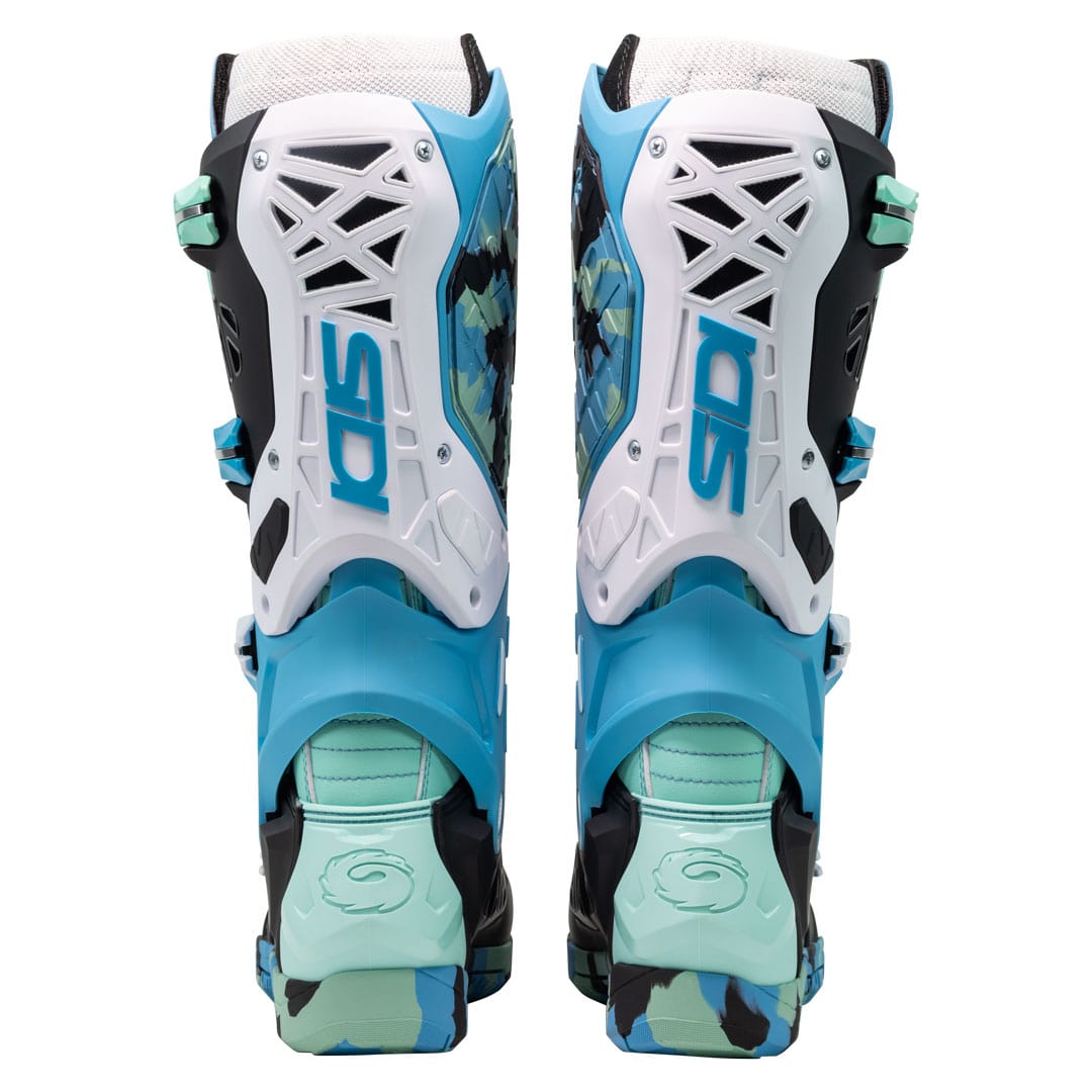 back of a pair of green blue and black motorcycle boots with sidi logo