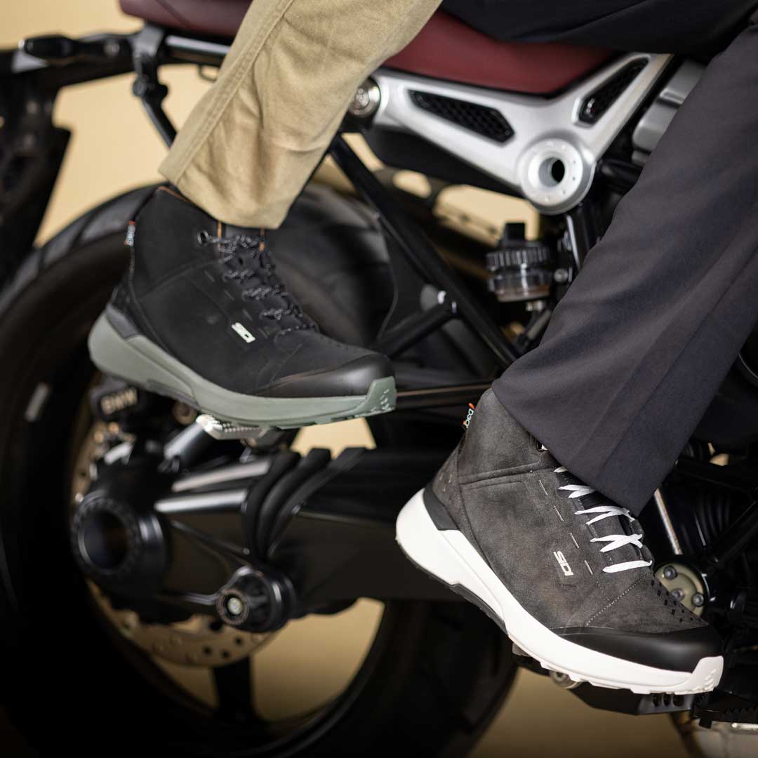 biker couple on motorbike wearing sidi motorcycle trainers
