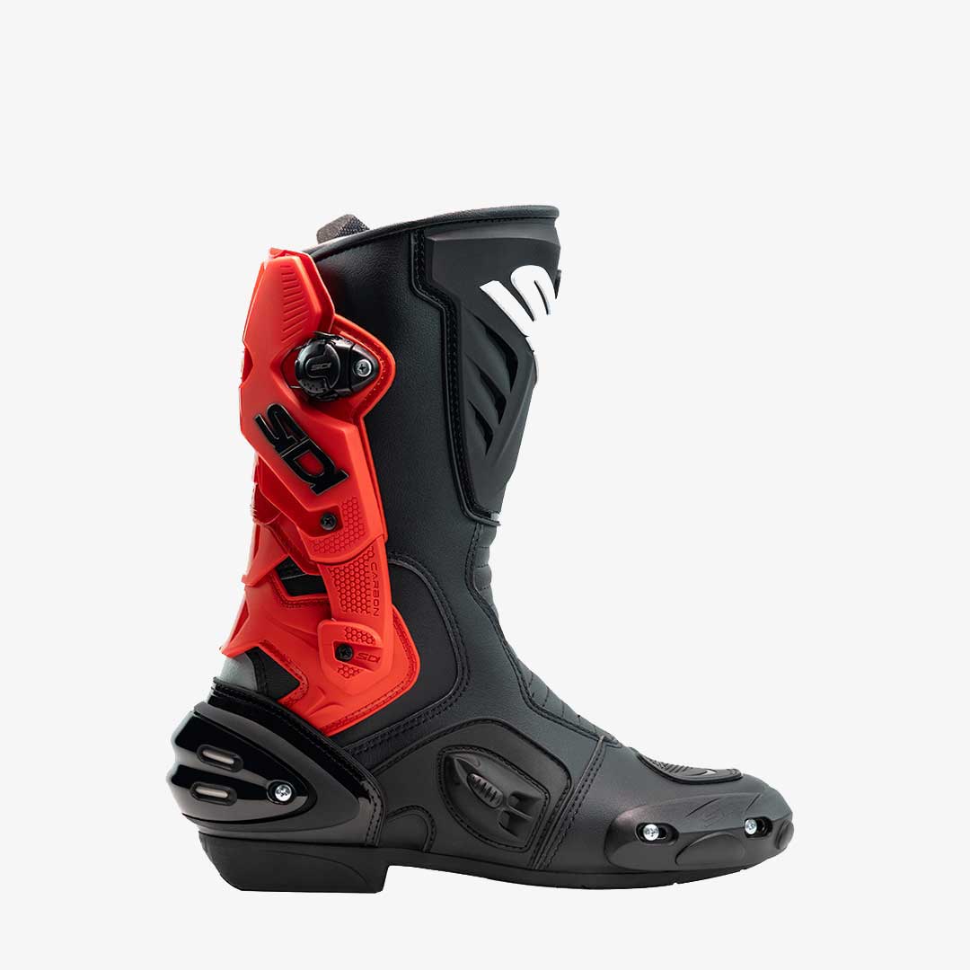Black and red motorcycle boot on a white background