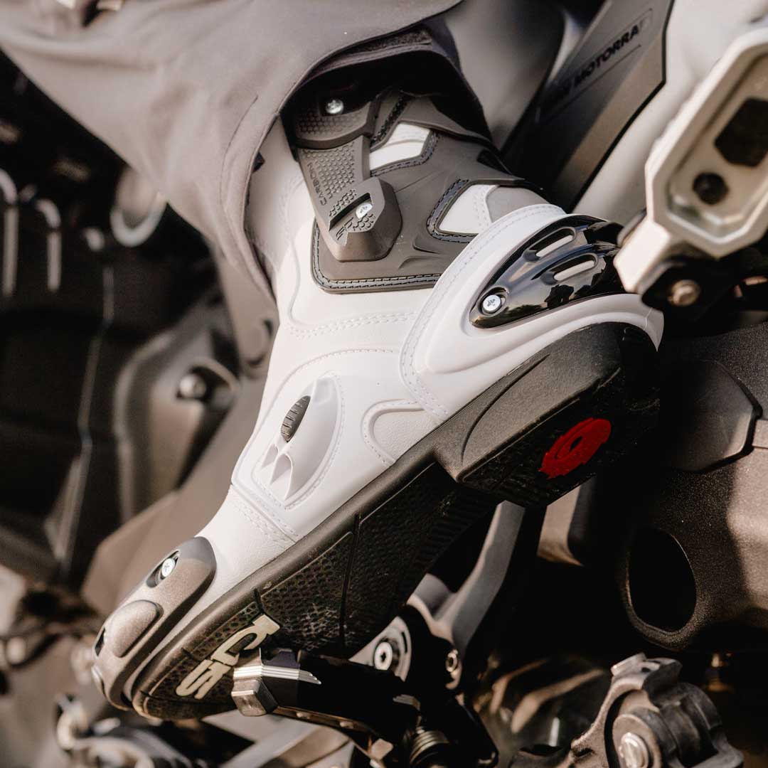 biker wearing black and white vertigo 2 sidi boot on bike