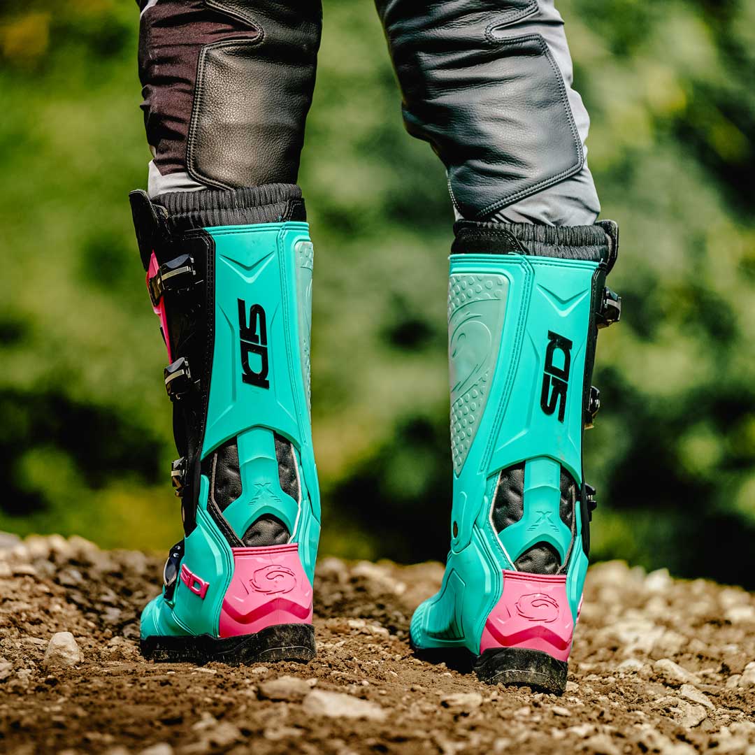 back of a pair of mint green sidi motorbike off road boots